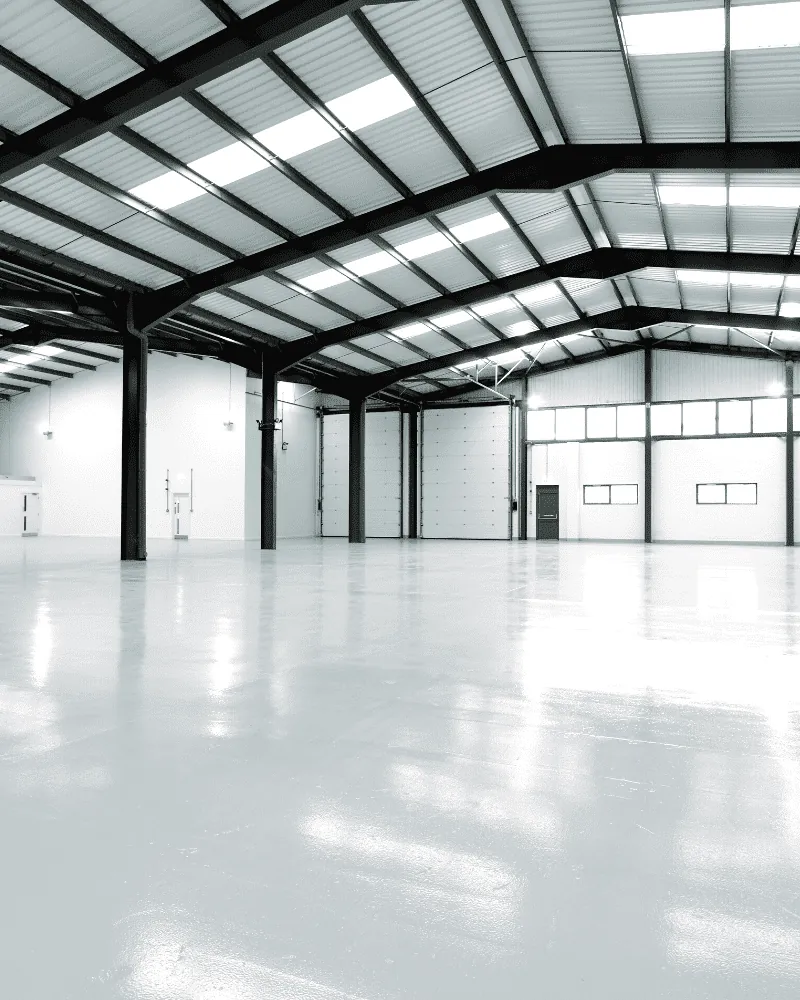 A cleared industrial unit flooded with rooflight