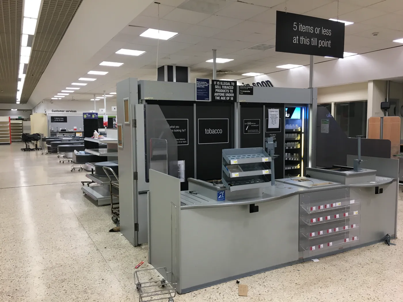 A supermarket sales floor cleared during a store closure